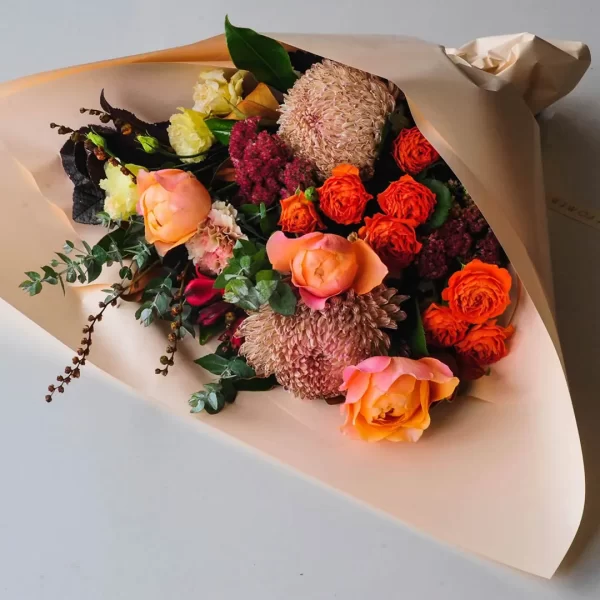 Elegant bouquet of roses, solidago, and hydrangeas in a garden mix