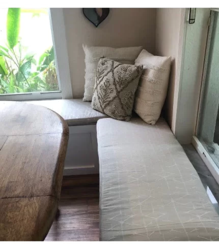 ```json { "alt_text": "Elegant rectangle window seat cushion in a cozy nook", "title": "Deluxe Window Seat Cushion - Optimal Comfort", "associated_text": "Enhance your space with our optimal comfort window seat cushion.", "description": "This image showcases a beautifully designed rectangle window seat cushion, perfectly fitted in a serene nook. The cushion features a plush, inviting appearance ideal for adding comfort and style to any room. Its soft fabric and meticulous tailoring reflect a high-quality, luxurious addition to home decor." } ```